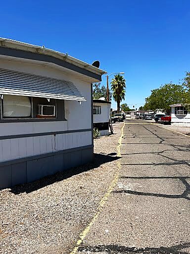 Mobile home with awning and palm trees