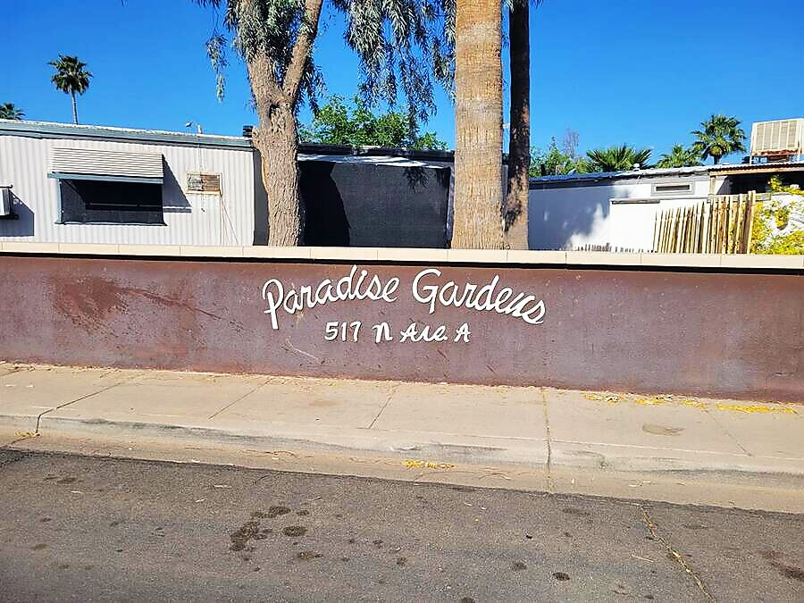 Paradise Gardens entrance sign at 517 N Ave A