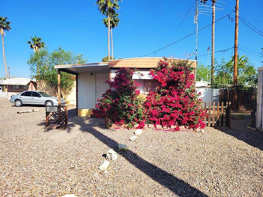 Home with vibrant bougainvillea in bloom